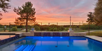 Beautiful sunset views from the pool and spa of 5121 Verdant Valley in Frisco, TX.